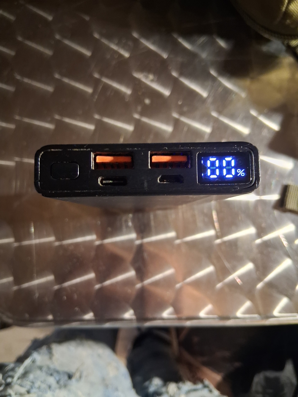 ASUS Black Power Bank with Orange USB Ports and Blue LED Display